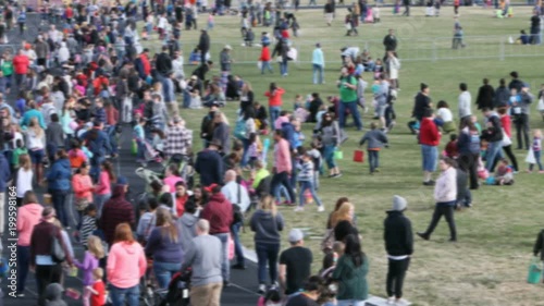 Wallpaper Mural Family children public Easter egg hunt event crowd blur. Large group crowd at public city Easter Egg hunt. Families, children and grandparents. Community fun and enjoyment. Torontodigital.ca