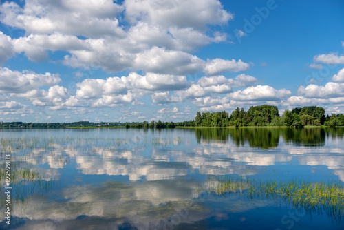 Fototapeta Naklejka Na Ścianę i Meble -  Lake Valday. Harmonious picture of a tranquil lake with reflections of trees and sky