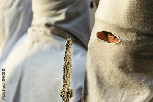 Detail of penitent performing his penance station photo