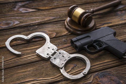 traumatic gun, hammer of the judge. Crime, robbery with the help of traumatic weapons, responsibility. committal and punishment, court and law