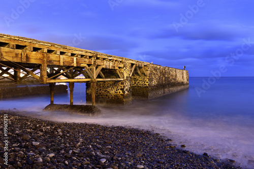 Old pier in Tenerife, photographed at night photo