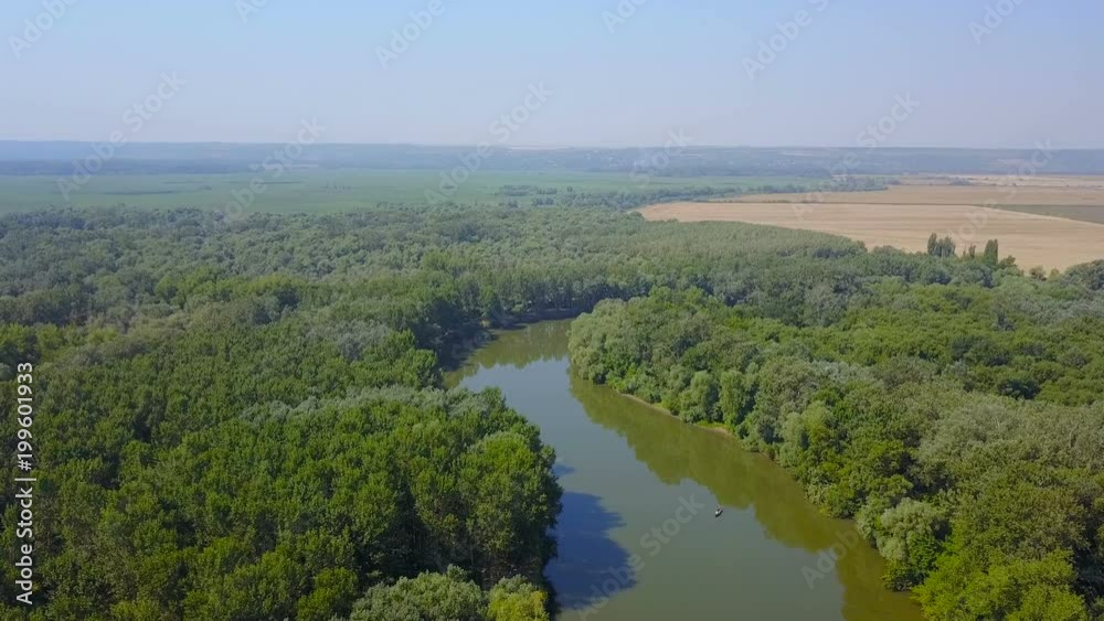 aerial view of beautiful countryside with river and forest in Ukraine aerial view of beautiful countryside with river and forest in Ukraine
