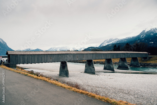 Old wooden bridge crossing the Rhine between Liechtenstein and Switzerland © Roman