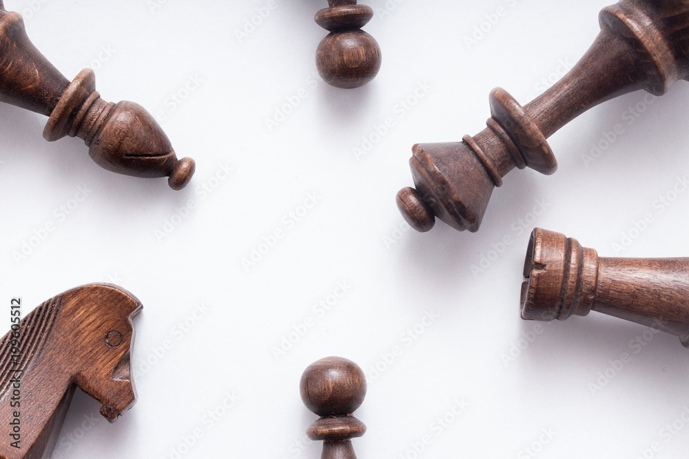 Chess game figures on white background , top view, flat lay Chess game figures on white background , top view, flat lay