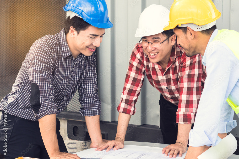 Engineer, contractor, worker teamwork. Group of construction people look at blueprint together and planning work schedule. Engineer, contractor, worker teamwork. Group of construction people look at blueprint together and planning work schedule.