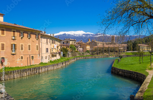 Tableau sur toile Rieti (Italy) - The historic center of the Sabina's provincial capital, under Mount Terminillo with snow and crossed by the river Velino