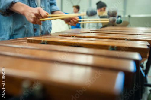Xylophone  marimba or mallet player with sticks 