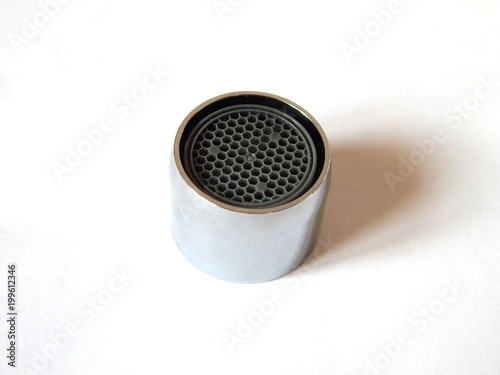 A metal aerator is designed to save water. Nozzle  for faucet. Injector nozzle for a water tap.