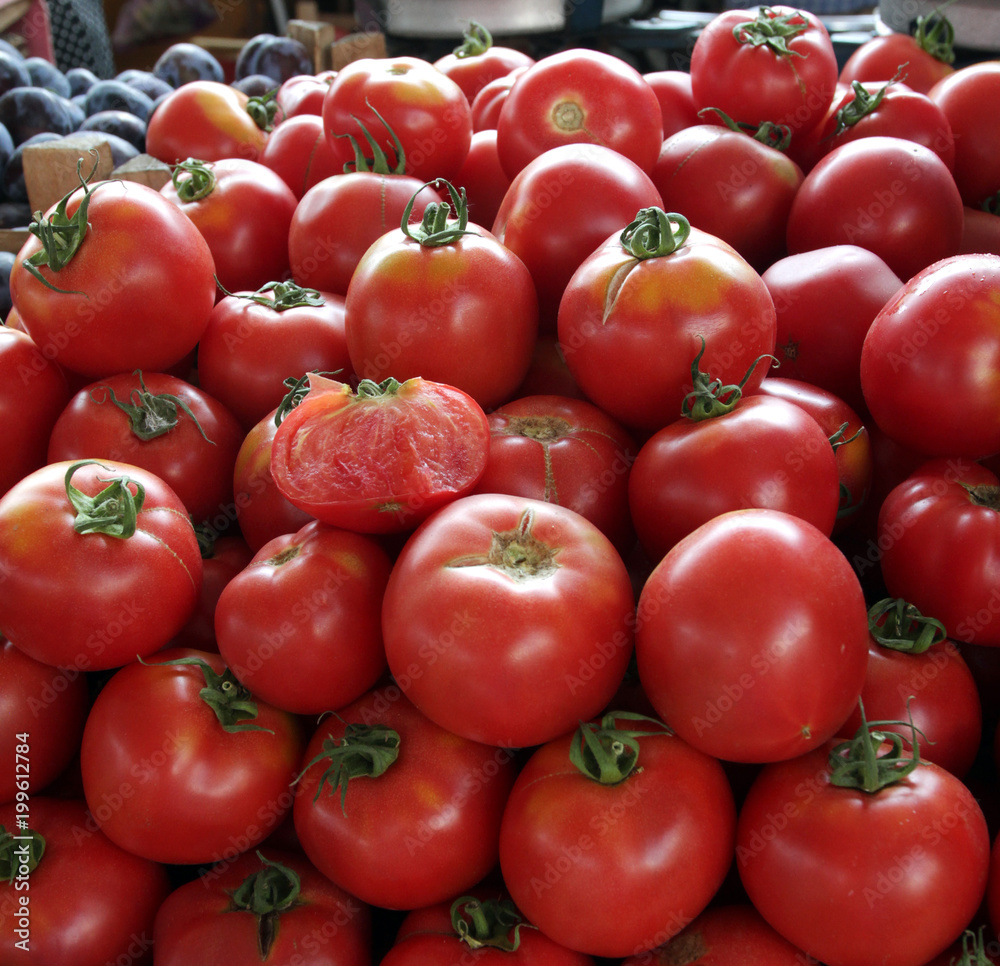 Tomatoes. Fresh organic tomatoes on a market, vegetables background. Salad of tomatoes. Tomato texture. Red tomatoes pattern. daylight Tomatoes. Fresh organic tomatoes on a market, vegetables background. Salad of tomatoes. Tomato texture. Red tomatoes pattern. daylight