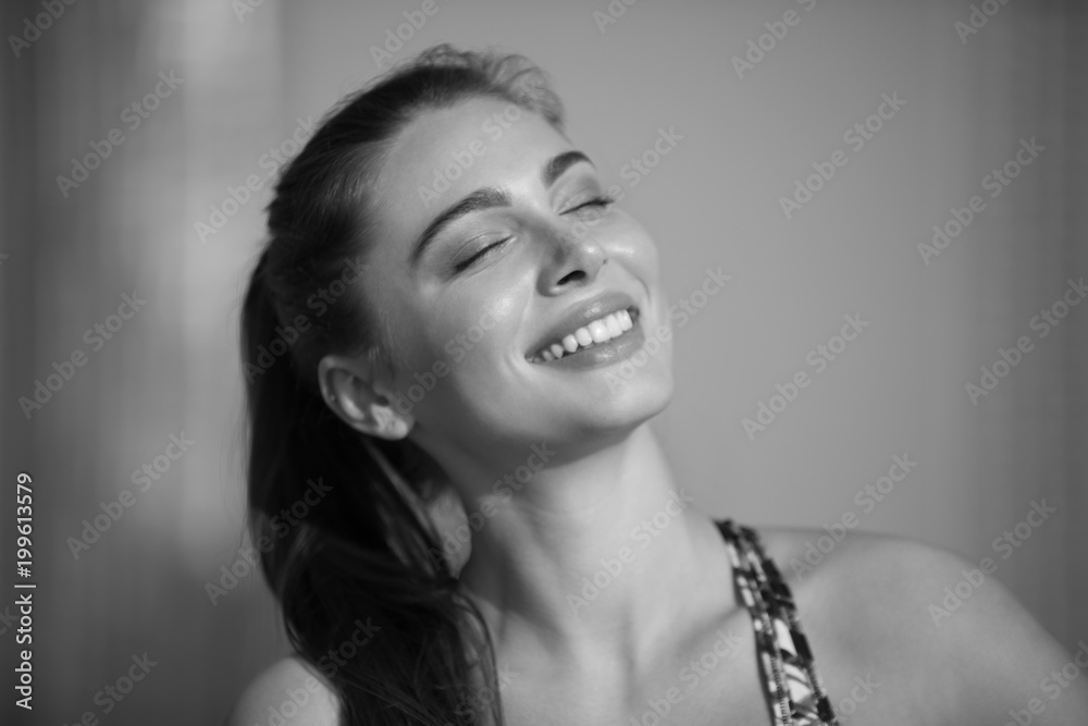 Obraz premium Portrait of an attractive sports woman. Sport and healthy lifestyle concept.