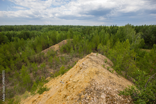 Underground old ore gold mine terricon slagheap rocks heap photo