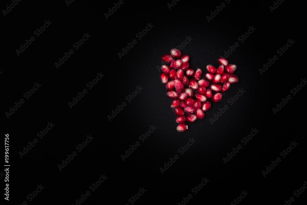 pomegranate seeds with heart shape pomegranate seeds with heart shape