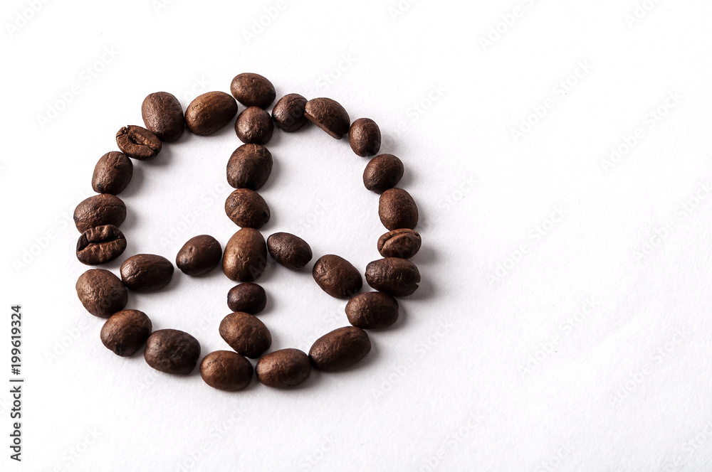 Coffee beans arranged as a peace sign isolated on white background with copyspace Coffee beans arranged as a peace sign isolated on white background with copyspace