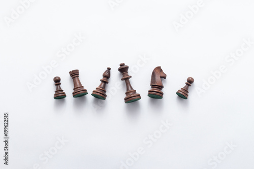 Chess game figures on white background , top view, flat lay