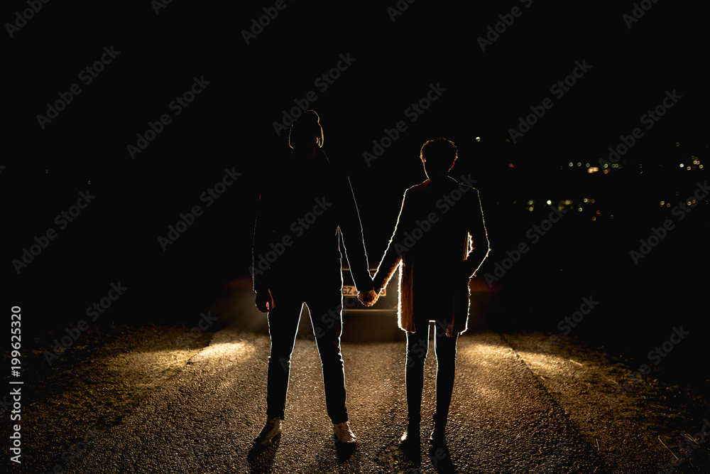 Silhouette%20of%20a%20couple%20holding%20hands%20Photos%20|%20Adobe%20Stock