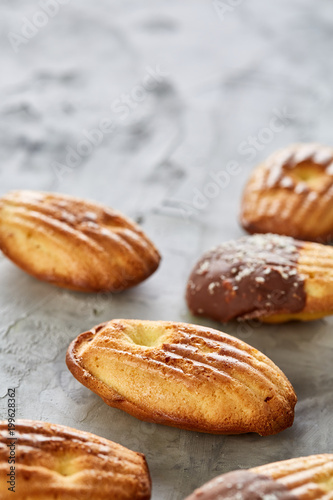 Tasty almond cookies arranged on white background, close-up, selective focus