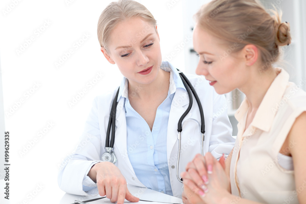 Doctor and patient during personal consulting in hospital Doctor and patient during personal consulting in hospital