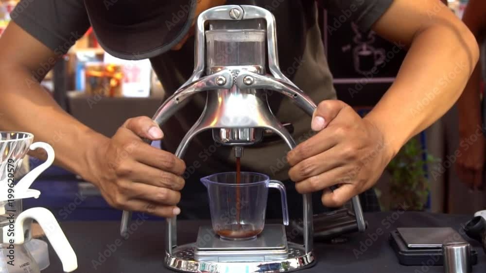 Barista making coffee with manual coffee makers Barista making coffee with manual coffee makers