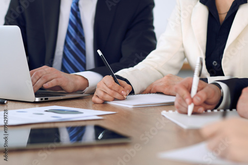 Group of business people or lawyers at meeting, hands close-up