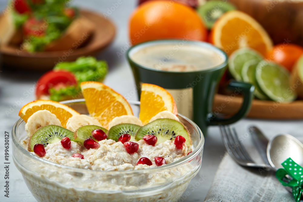 Breakfast still life with oatmeal porridge and fruits, top view, selective focus, shallow depth of field. Breakfast still life with oatmeal porridge and fruits, top view, selective focus, shallow depth of field.