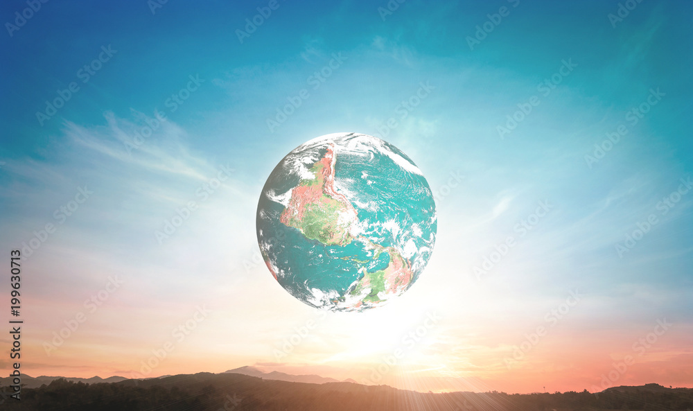 Naklejka premium Earth globe in clear blue and sunset sky over scenic landscape