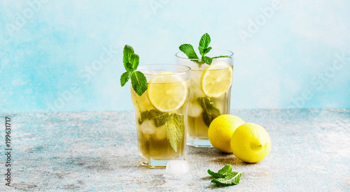  iced green tea with lemon and fresh mint .Copy space