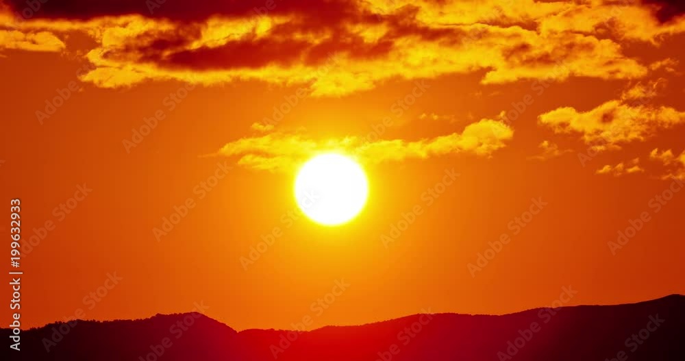 Time lapse of the sun rising from behind the mountains Time lapse of the sun rising from behind the mountains