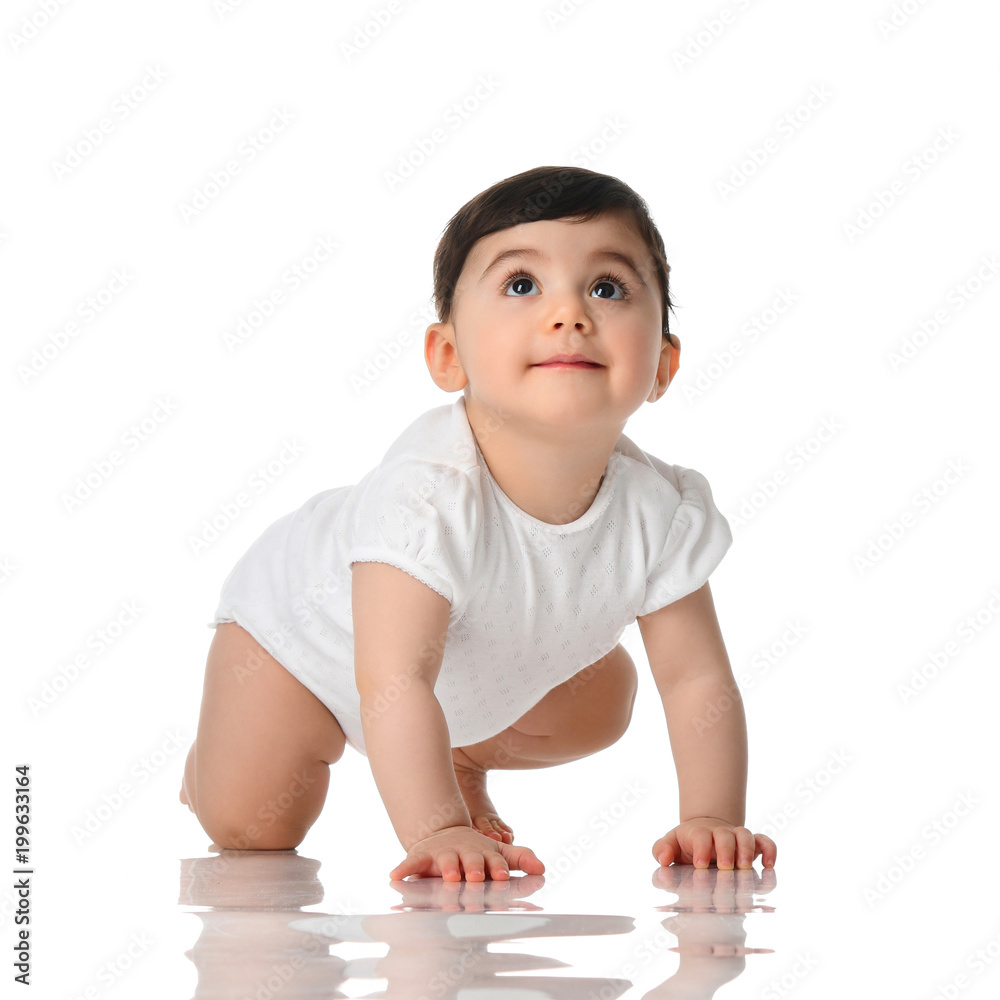 Ten month infant child baby girl toddler crawling in white shirt looking up isolated Ten month infant child baby girl toddler crawling in white shirt looking up isolated