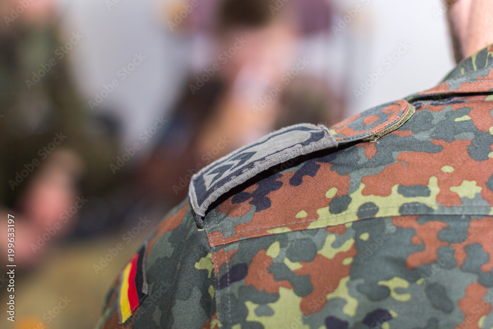 a shoulder strap on a german military uniform a shoulder strap on a german military uniform