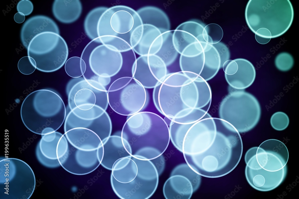 A colorful background of bokeh lights in cool tones. A colorful background of bokeh lights in cool tones.