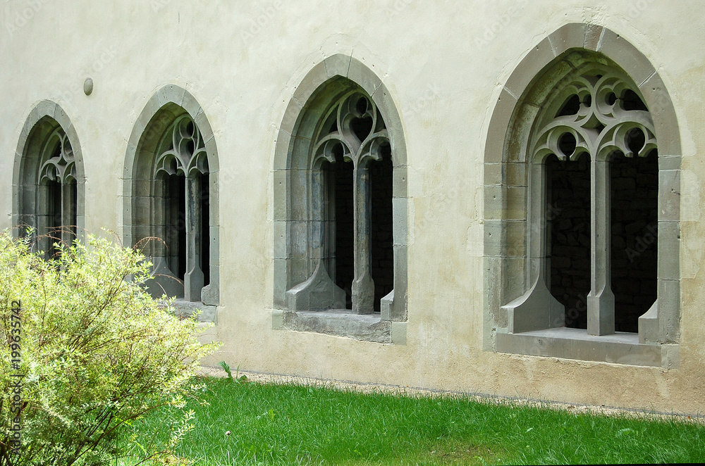 Romanesque windows of the former All Saints Benedictine Abbey (Kloster Allerheiligen) in the heart of the old town - Schaffhausen, Switzerland