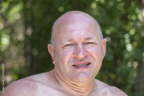 Portrait of middle-aged man relaxing in nature