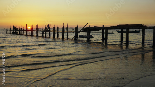 wooden jetty in the sunset