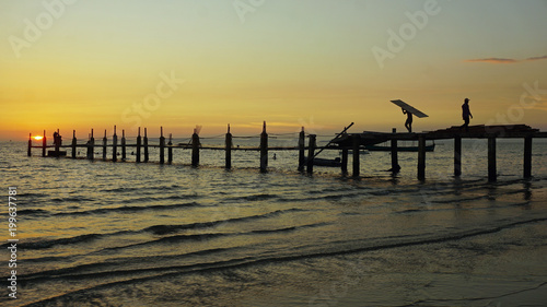 wooden jetty in the sunset