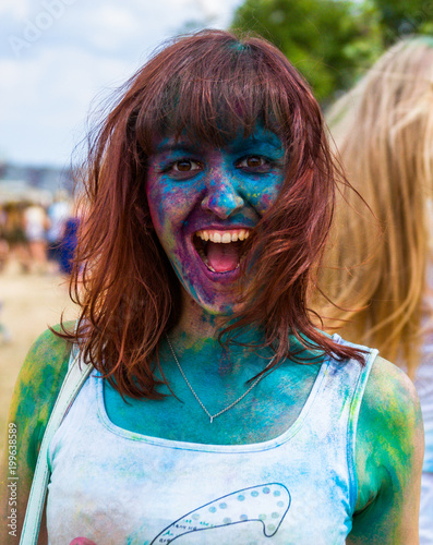 Fototapeta Naklejka Na Ścianę i Meble -  girl joyfully emotionally screams shout at Holi Colors Festival