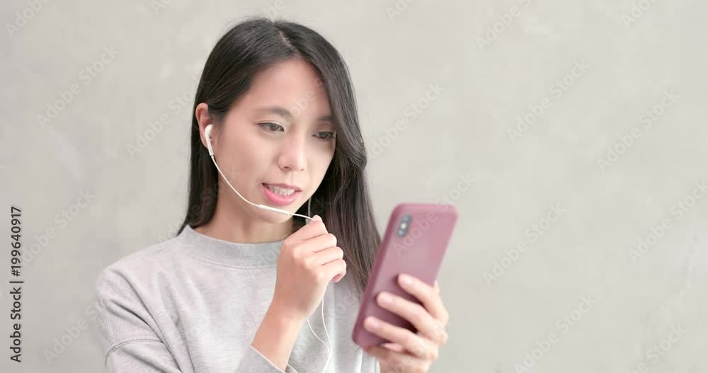 Woman talking on hand free with mobile phone Woman talking on hand free with mobile phone