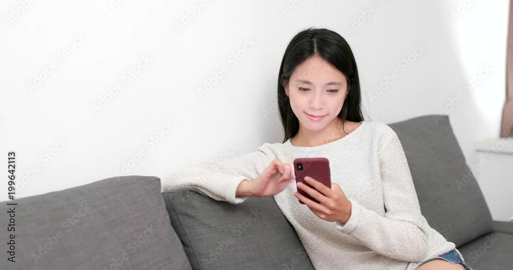 Woman use of smart phone at home Woman use of smart phone at home