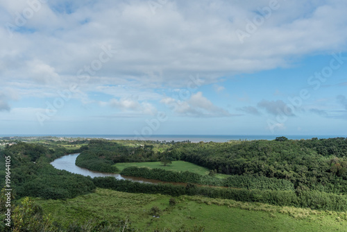 Fototapeta Naklejka Na Ścianę i Meble -  Picturesque Wailua River vista after a major rainstorm on Kauai, Hawaii	