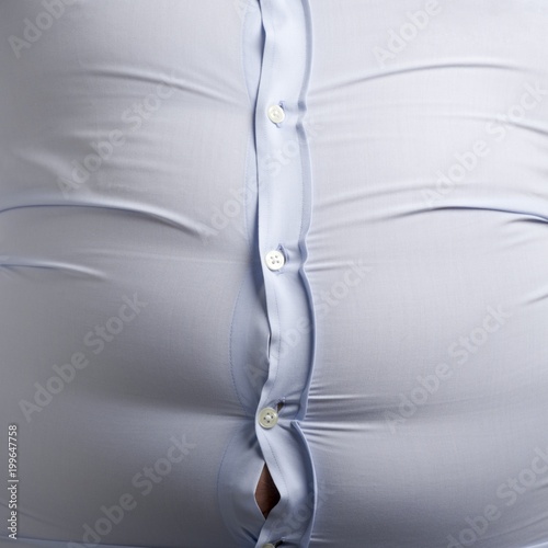 Overweight man with bulging shirt buttons