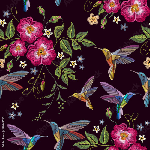 Humming birds and wild roses embroidery seamless pattern. Decorative floral embroidery fashion template for clothes, t-shirt design. Elegant flowers dogrose and tropical humming bird pattern