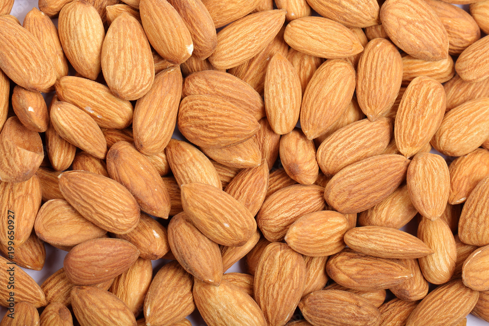 Almonds isolated. Group of almond nuts isolated on white background. Full depth of field Almonds isolated. Group of almond nuts isolated on white background. Full depth of field
