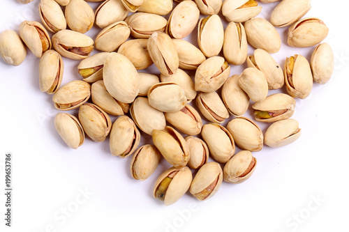 Unshelled roasted and salted cashew nuts isolated on white background