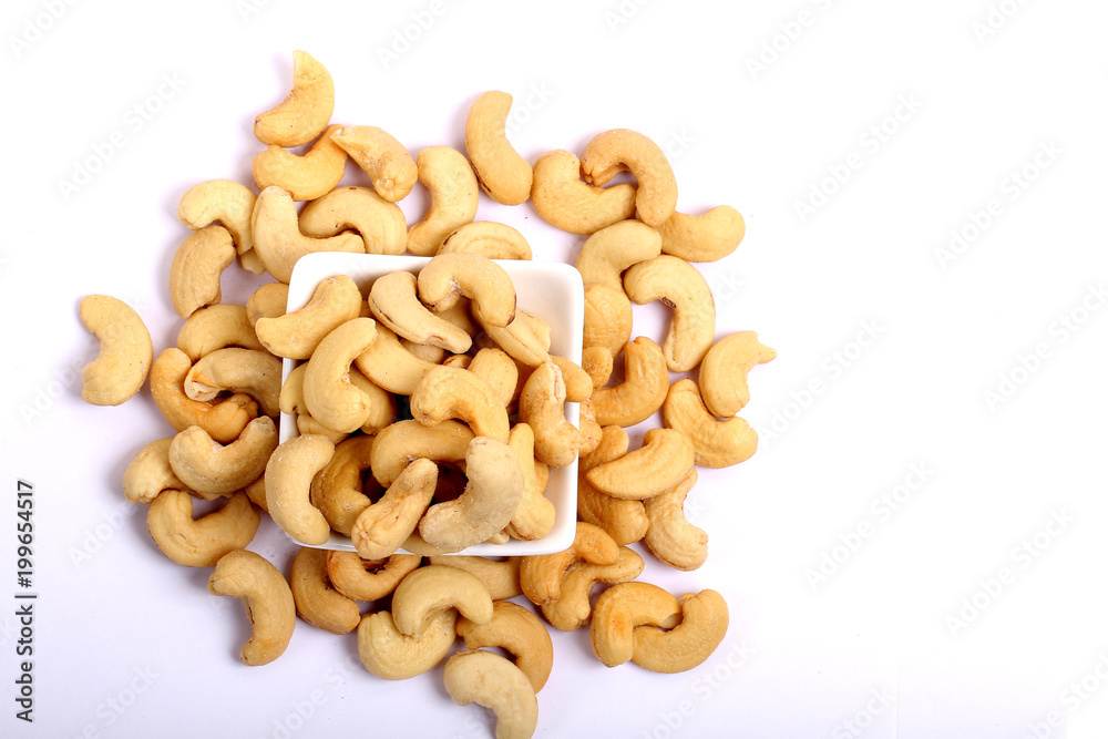 Unshelled roasted and salted cashew nuts isolated on white background Unshelled roasted and salted cashew nuts isolated on white background