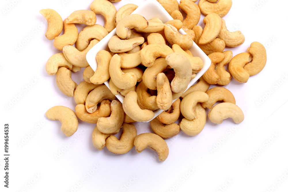 Unshelled roasted and salted cashew nuts isolated on white background Unshelled roasted and salted cashew nuts isolated on white background