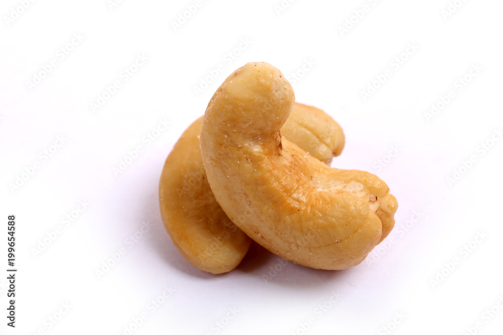 Unshelled roasted and salted cashew nuts isolated on white background Unshelled roasted and salted cashew nuts isolated on white background