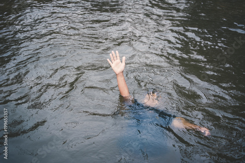 Obraz na plátně Asian boy drowning in the pool dangerous and need to help, Child care in the sum
