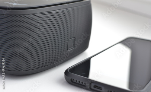 Portable acoustics and smartphone close-up. Stereo Acoustics.