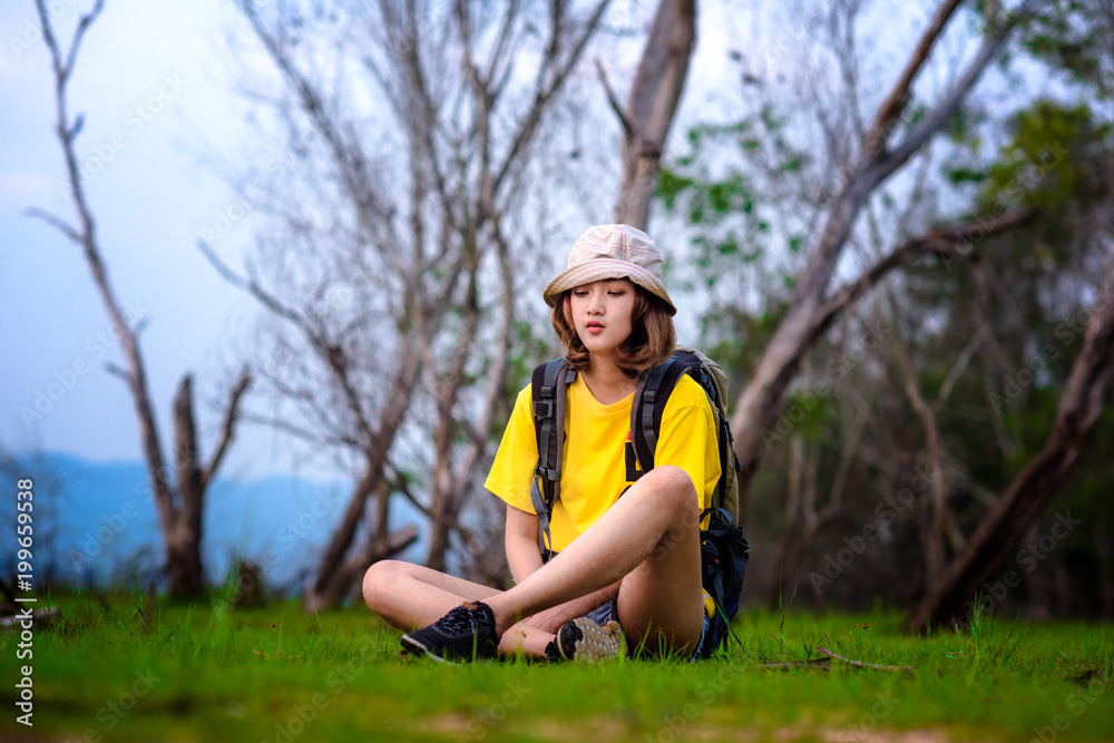 woman traveller upset and tired in lost of the way, lost direction in the rainforest, worry in upcoming everning alone staying in dark woman traveller upset and tired in lost of the way, lost direction in the rainforest, worry in upcoming everning alone staying in dark