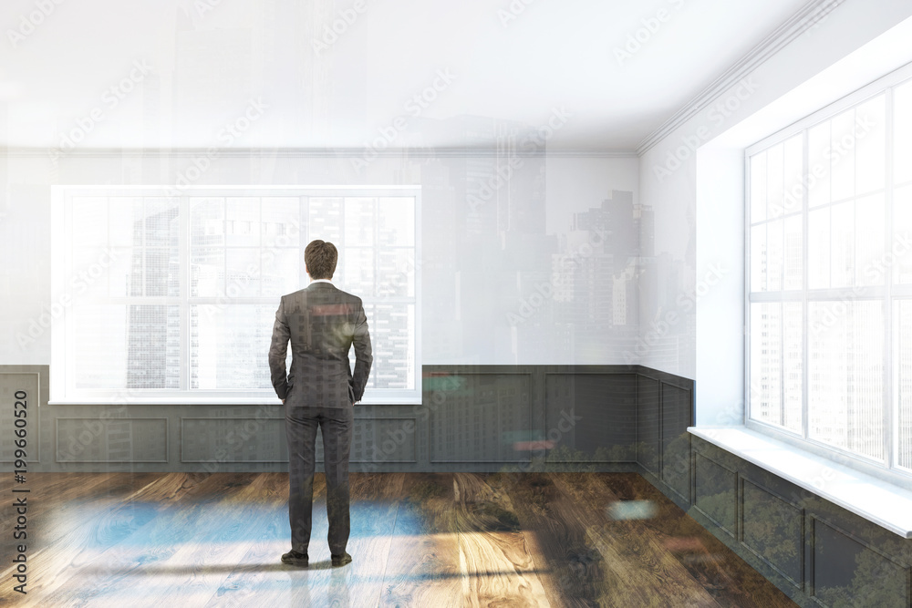 Man in a white and gray unfurnished room Man in a white and gray unfurnished room