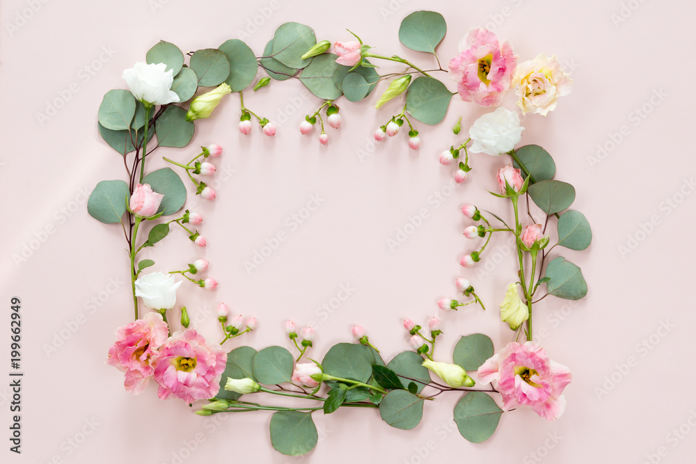 Fototapeta premium Pink roses on white background. Flat lay. Frame wreath